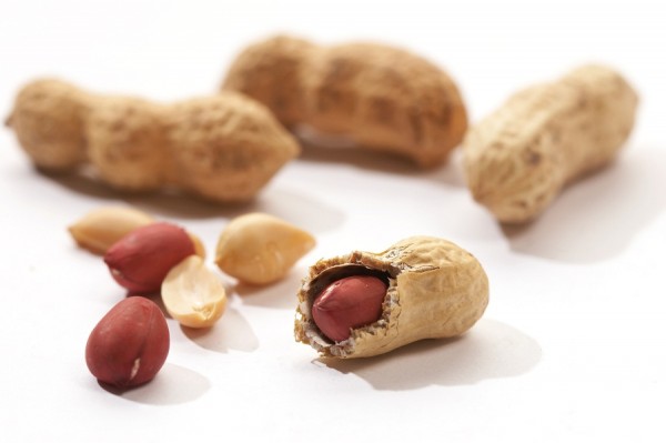 some peanuts over white background